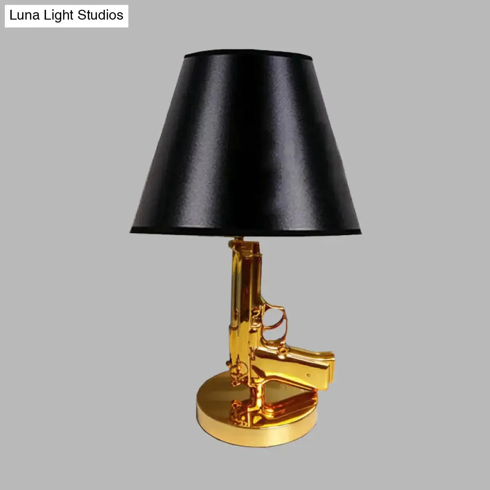 Modernist Black Barrel Shade Table Light with Gold Gun-Shaped Body - 1-Head Fabric Desk Lamp