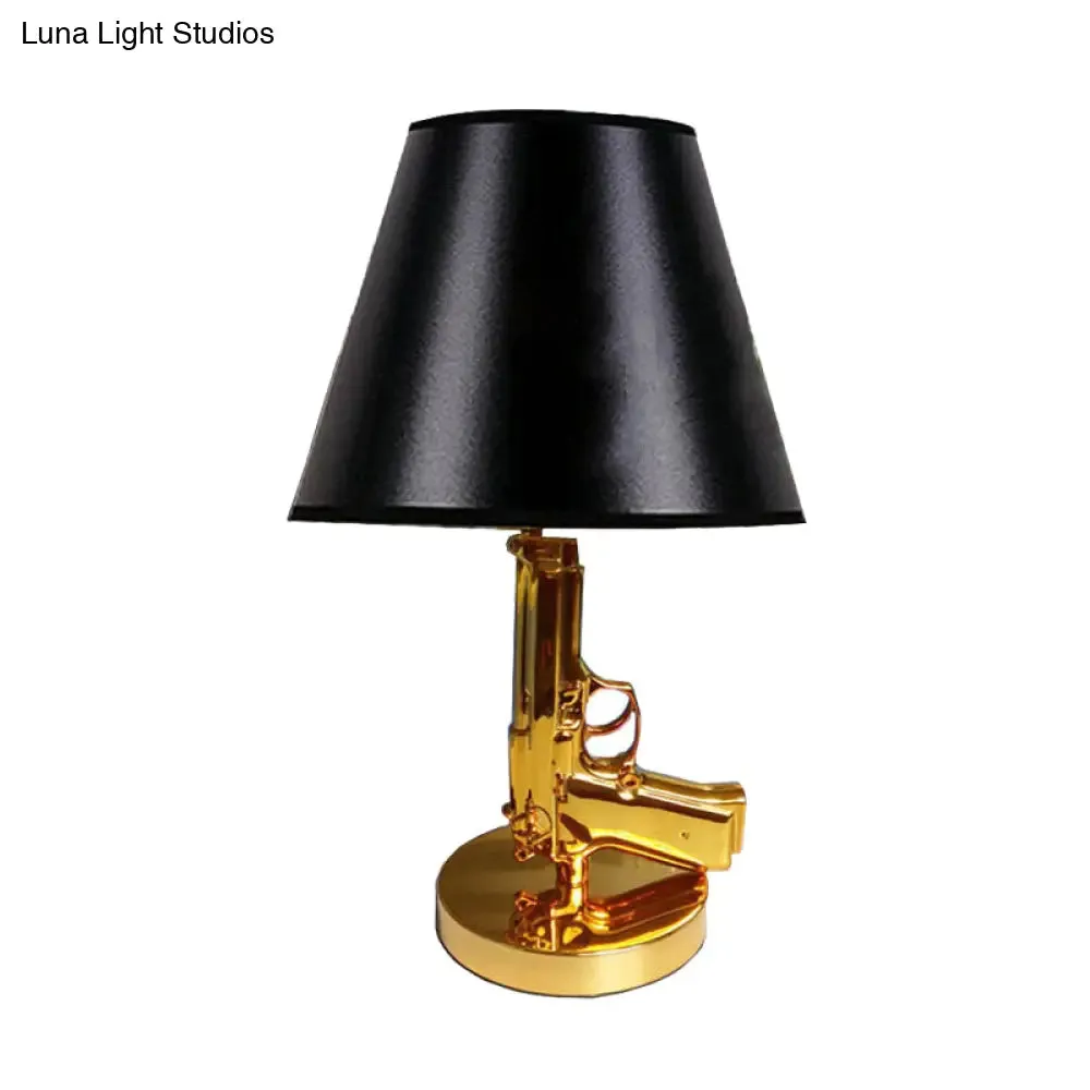 Modernist Black Barrel Shade Table Light with Gold Gun-Shaped Body - 1-Head Fabric Desk Lamp